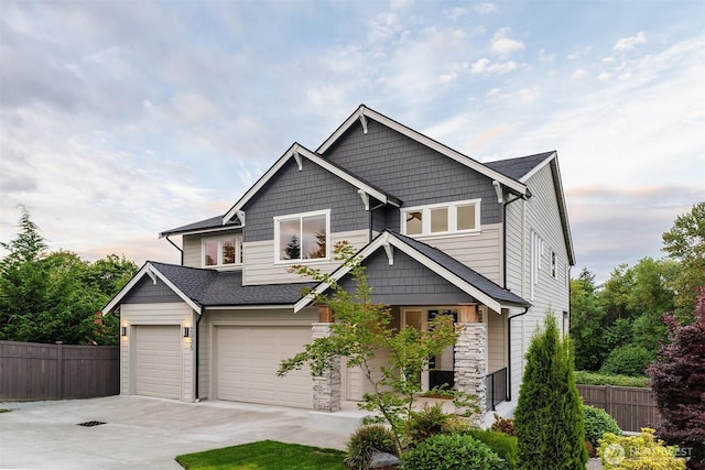 2035 S Fruitland, Puyallup, WA 98371 - craftsman-style home featuring concrete driveway, stone siding, and a garage