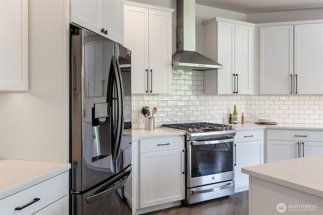 2035 S Fruitland, Puyallup, WA 98371 - kitchen with fridge with ice dispenser, wall chimney range hood, stainless steel range with gas cooktop, and backsplash