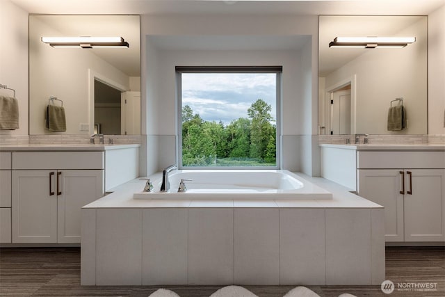 2035 S Fruitland, Puyallup, WA 98371 - full bath featuring two vanities, a garden tub, and wood finished floors