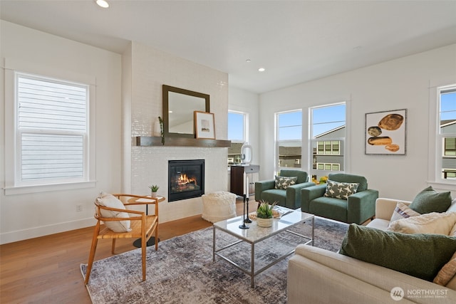 310 W Fir Loop, Washougal, WA 98671 - living area with wood finished floors, healthy amount of natural light, a fireplace, and recessed lighting