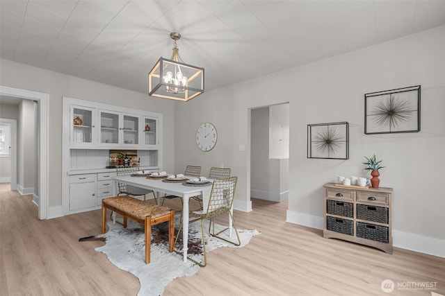 13806 Macadam Rd S, Tukwila, WA 98168 - dining room with a chandelier and light wood-style floors