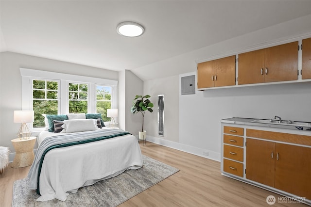 13806 Macadam Rd S, Tukwila, WA 98168 - bedroom with vaulted ceiling, electric panel, and light wood-style floors