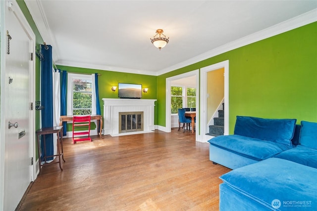 2726 34th Ave S, Seattle, WA 98144 - living area featuring plenty of natural light, wood finished floors, crown molding, a brick fireplace, and stairway