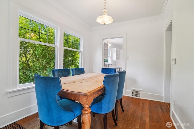 2726 34th Ave S, Seattle, WA 98144 - dining space featuring wood finished floors and crown molding