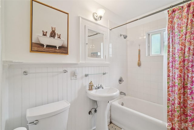 2726 34th Ave S, Seattle, WA 98144 - bathroom with shower / bath combination with curtain, a wainscoted wall, and a decorative wall