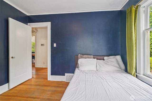 2726 34th Ave S, Seattle, WA 98144 - bedroom featuring wood finished floors and ornamental molding