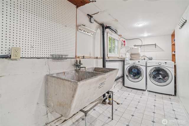 2726 34th Ave S, Seattle, WA 98144 - washroom with washer and dryer and tile patterned flooring