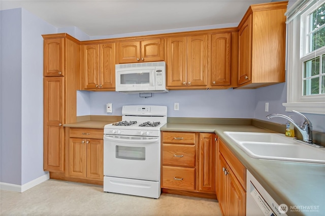 4015 N 13th St, Tacoma, WA 98406 - kitchen with white appliances, brown cabinets, and light countertops
