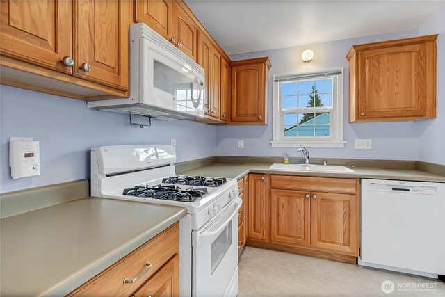 4015 N 13th St, Tacoma, WA 98406 - kitchen with white appliances, brown cabinets, and light countertops
