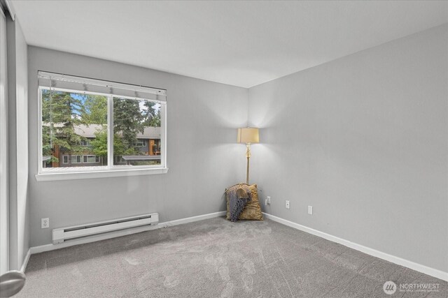10831 NE 147th Ln Unit R202, Bothell, WA 98011 - carpeted spare room with a baseboard heating unit and baseboards