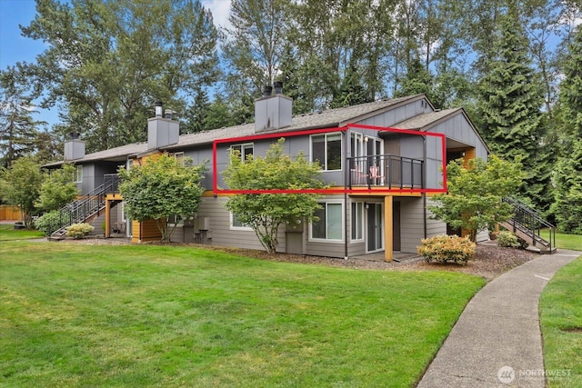 10831 NE 147th Ln Unit R202, Bothell, WA 98011 - rear view of property with stairway, a chimney, a yard, and a wooden deck