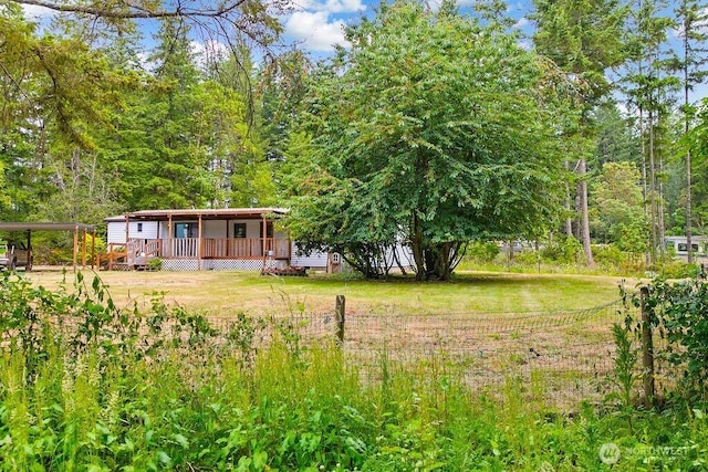 4960 SW Daisy St, Port Orchard, WA 98367 - view of yard with a deck and a detached carport