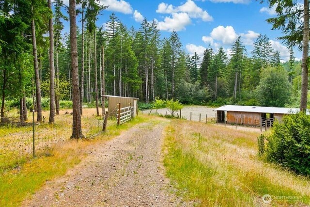 4960 SW Daisy St, Port Orchard, WA 98367 - view of street with an exterior structure and a forest view