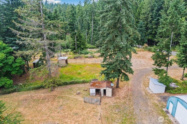4960 SW Daisy St, Port Orchard, WA 98367 - view of yard featuring an outdoor structure and a wooded view