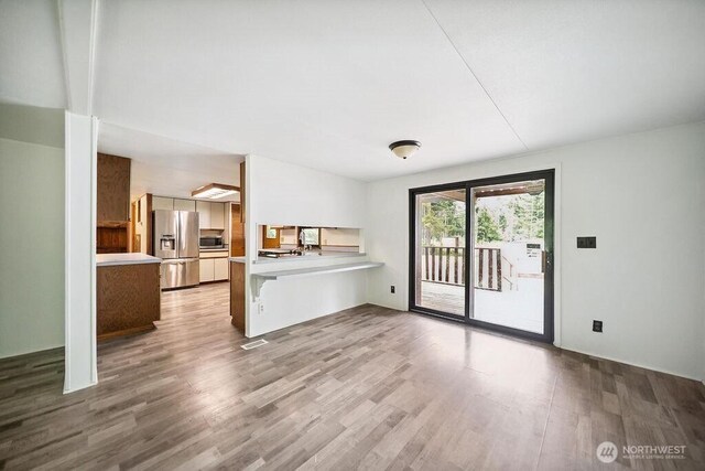 4960 SW Daisy St, Port Orchard, WA 98367 - unfurnished living room with wood finished floors
