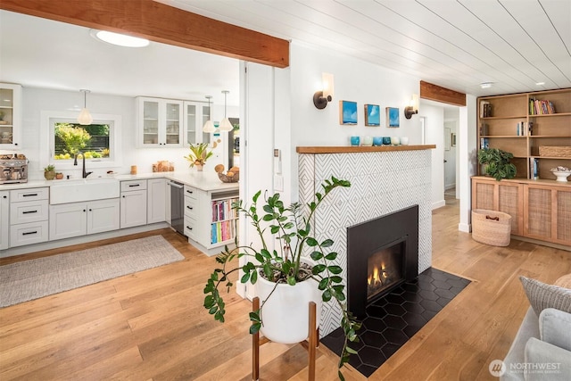 10426 SW 112th St, Vashon, WA 98070 - living area with light wood finished floors, a tile fireplace, and wooden ceiling