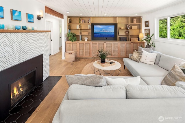 10426 SW 112th St, Vashon, WA 98070 - living room with wood finished floors, a fireplace, built in features, recessed lighting, and wood ceiling