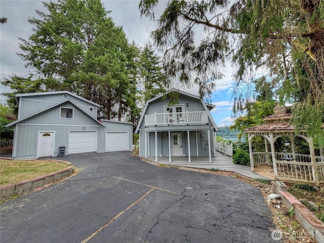 81 E Panorama Way, Grapeview, WA 98546 - view of front of house featuring a gazebo, an outbuilding, a garage, and asphalt driveway