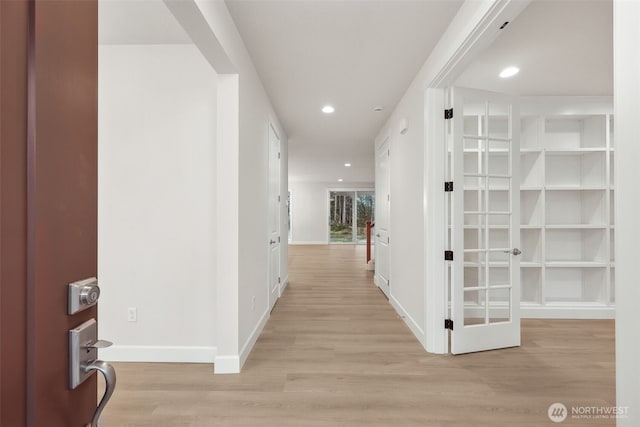 13600 100th St NE Unit 212, Lake Stevens, WA 98258 - hallway with light wood-style flooring and recessed lighting