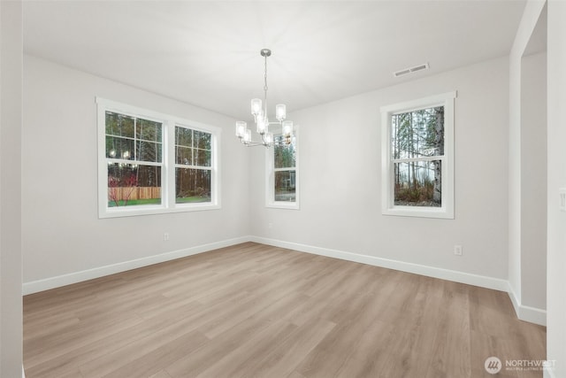 13600 100th St NE Unit 212, Lake Stevens, WA 98258 - unfurnished room featuring a chandelier and light wood-style floors
