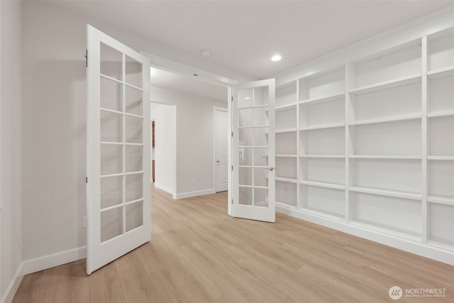 13600 100th St NE Unit 212, Lake Stevens, WA 98258 - spare room featuring french doors, wood finished floors, and recessed lighting