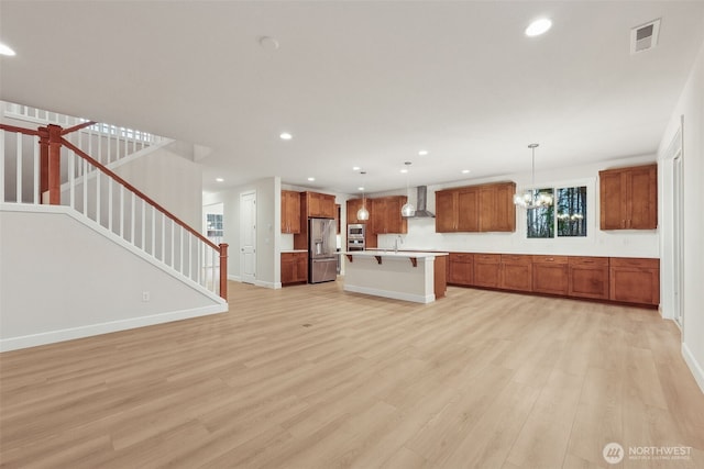 13600 100th St NE Unit 212, Lake Stevens, WA 98258 - unfurnished living room with light wood-style floors, recessed lighting, stairs, and a chandelier