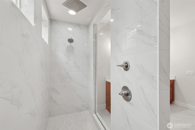 13600 100th St NE Unit 212, Lake Stevens, WA 98258 - bathroom featuring marble finish floors, a marble finish shower, and vanity
