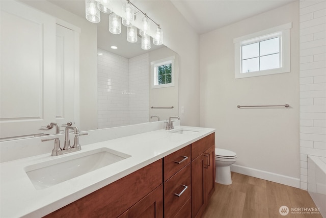 13600 100th St NE Unit 212, Lake Stevens, WA 98258 - full bathroom with double vanity and wood finished floors