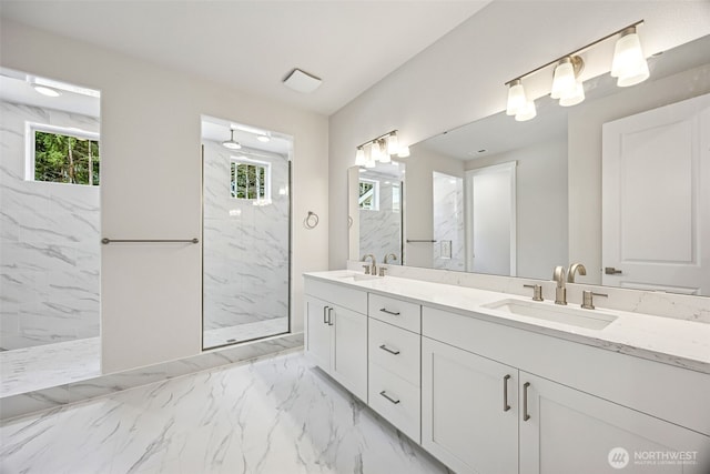 13600 100th St NE Unit 212, Lake Stevens, WA 98258 - bathroom featuring marble finish flooring, double vanity, and a marble finish shower