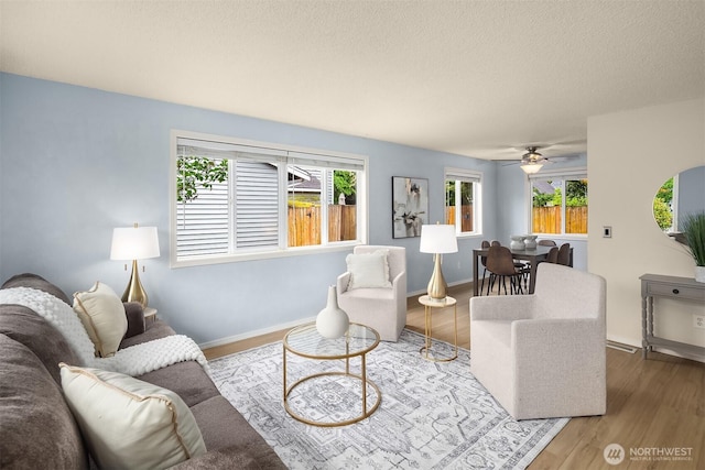 15484 174th Ave SE, Monroe, WA 98272 - living area featuring ceiling fan, wood finished floors, and a textured ceiling