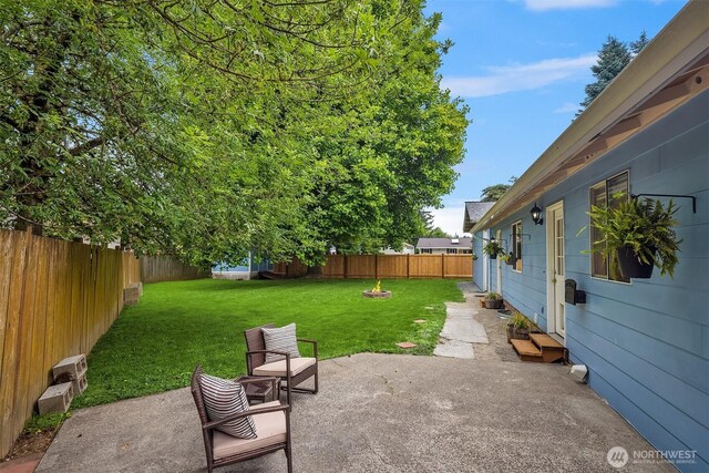 15484 174th Ave SE, Monroe, WA 98272 - fenced backyard featuring a patio area