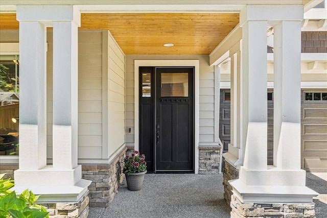 6555 125th Ave NE, Kirkland, WA 98033 - doorway to property with covered porch and stone siding