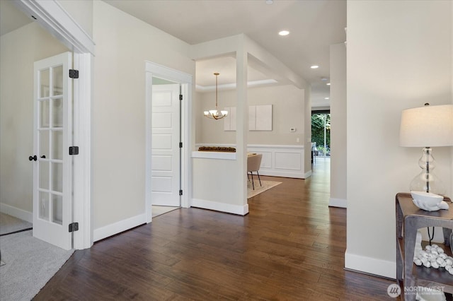 6555 125th Ave NE, Kirkland, WA 98033 - hall featuring dark wood finished floors, recessed lighting, and a chandelier