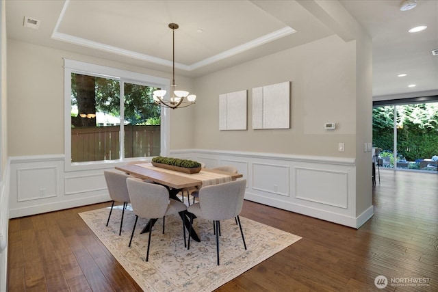 6555 125th Ave NE, Kirkland, WA 98033 - dining area with a raised ceiling, a chandelier, a decorative wall, a wainscoted wall, and dark wood-type flooring