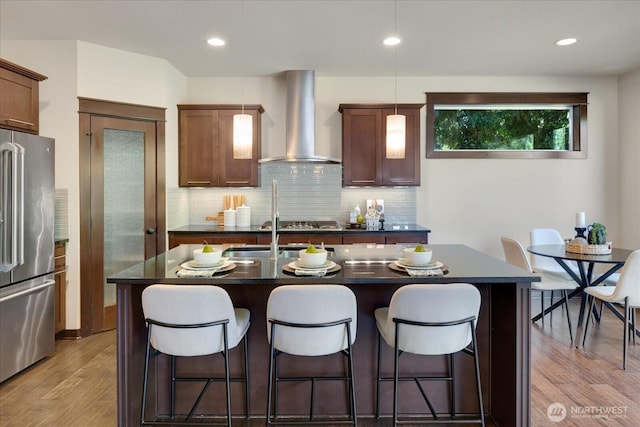 6555 125th Ave NE, Kirkland, WA 98033 - kitchen with wall chimney range hood, appliances with stainless steel finishes, dark countertops, tasteful backsplash, and recessed lighting