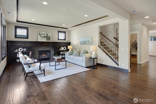 6555 125th Ave NE, Kirkland, WA 98033 - living room featuring a raised ceiling, stairway, wood finished floors, healthy amount of natural light, and recessed lighting