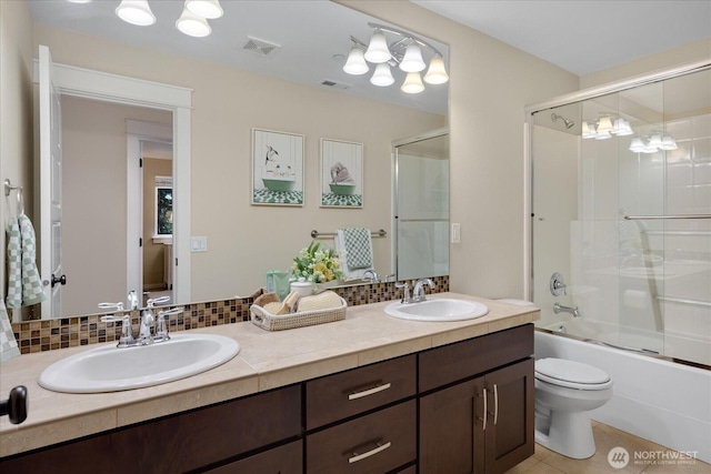 6555 125th Ave NE, Kirkland, WA 98033 - bathroom featuring double vanity, backsplash, enclosed tub / shower combo, and tile patterned flooring