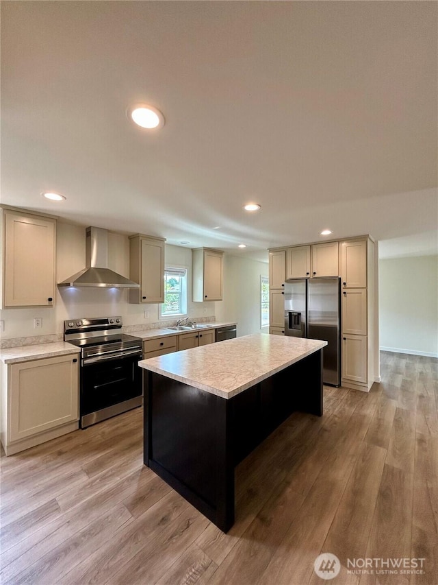 40 E Skywater Pl, Shelton, WA 98584 - kitchen with wall chimney range hood, appliances with stainless steel finishes, a center island, light countertops, and recessed lighting