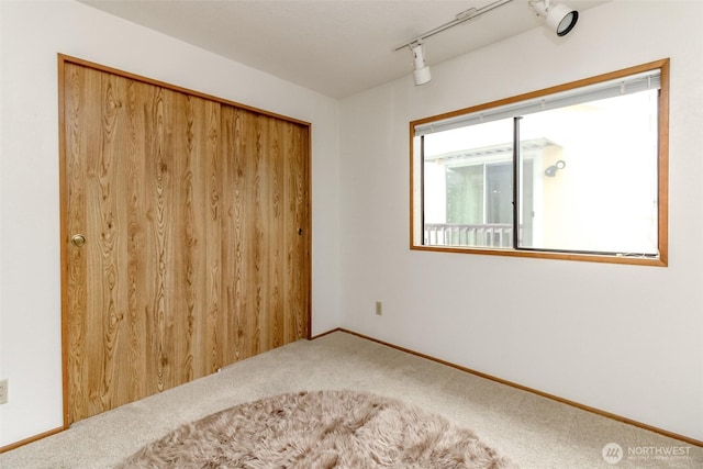 37301 28th Ave S Unit 34, Federal Way, WA 98003 - carpeted empty room with track lighting and baseboards
