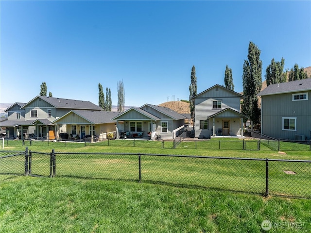 2135 Roper Ln, Wenatchee, WA 98801 - back of house featuring a fenced backyard and board and batten siding