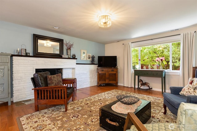 7923 220th St SW, Edmonds, WA 98026 - living room featuring wood finished floors and a fireplace