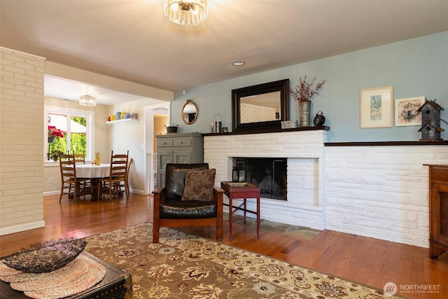 7923 220th St SW, Edmonds, WA 98026 - living room with a brick fireplace and wood finished floors