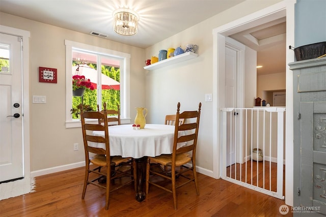 7923 220th St SW, Edmonds, WA 98026 - dining space featuring wood finished floors and a chandelier