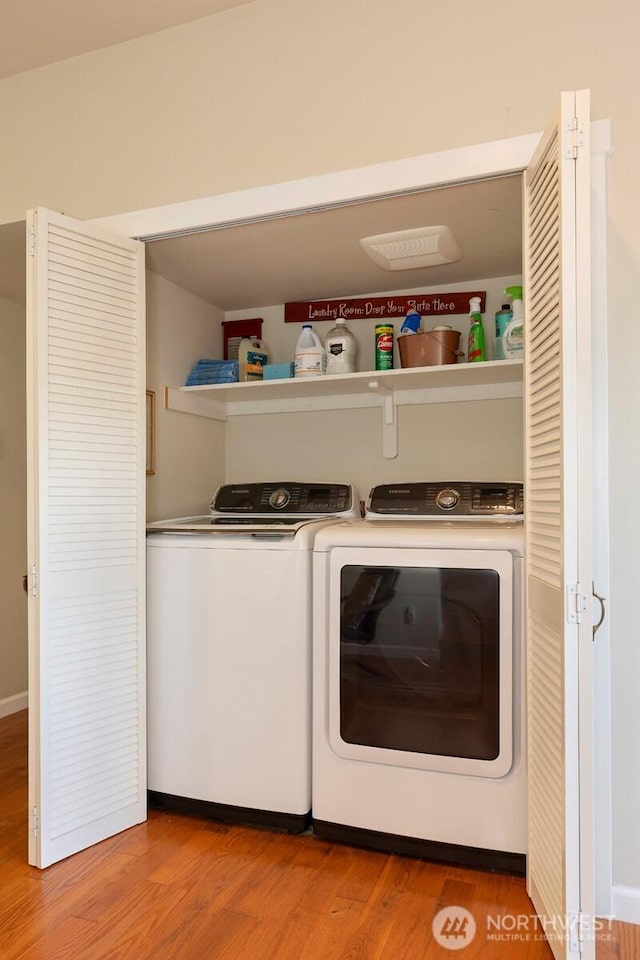 7923 220th St SW, Edmonds, WA 98026 - laundry area featuring washing machine and clothes dryer and light wood-style flooring