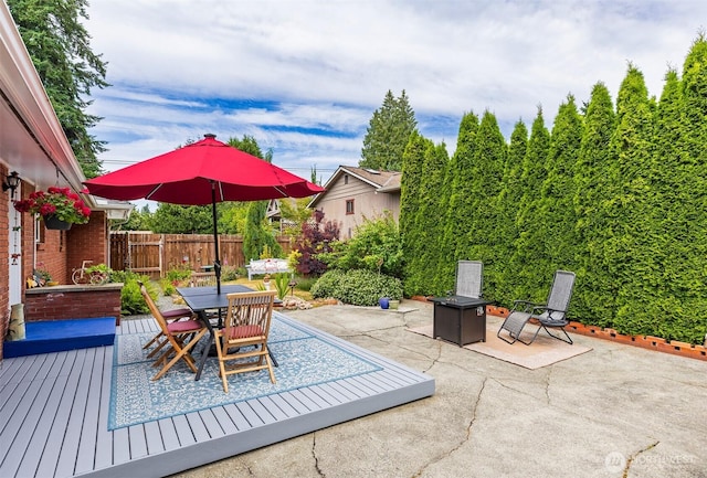 7923 220th St SW, Edmonds, WA 98026 - view of patio / terrace featuring an outdoor fire pit, outdoor dining space, and a deck
