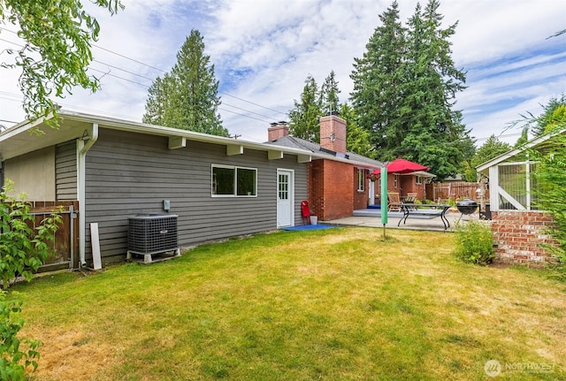 7923 220th St SW, Edmonds, WA 98026 - rear view of house with a chimney and a patio area