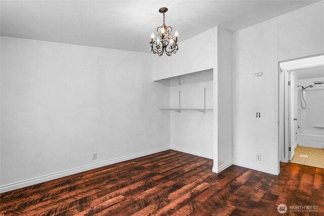 20102 119th St E, Sumner, WA 98390 - unfurnished dining area with a chandelier and wood finished floors