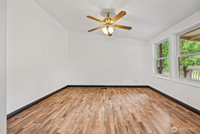 11510 Joletta Ave SW, Port Orchard, WA 98367 - spare room featuring wood finished floors and a ceiling fan