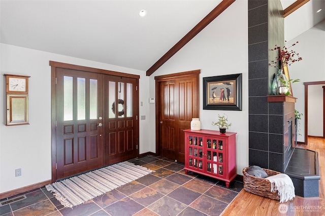 931 SW Moose Hill Ct, Port Orchard, WA 98367 - entryway featuring lofted ceiling and dark stone finish floors