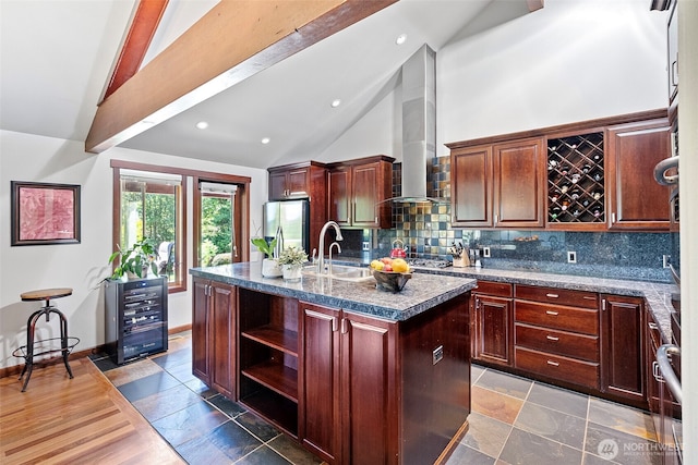931 SW Moose Hill Ct, Port Orchard, WA 98367 - kitchen featuring wine cooler, stainless steel fridge with ice dispenser, tasteful backsplash, high vaulted ceiling, and wall chimney range hood